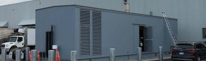 Industrial generator enclosure at a facility